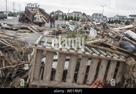 City workers unload mounds of trash on an empty parking lot on Long Beach Island as they begin the cleanup November 1, 2012. Many homes on this resort New Jersey island were destroyed when Hurricane Sandy hit the area late October 29, 2012.                     UPI/John Anderson Stock Photo