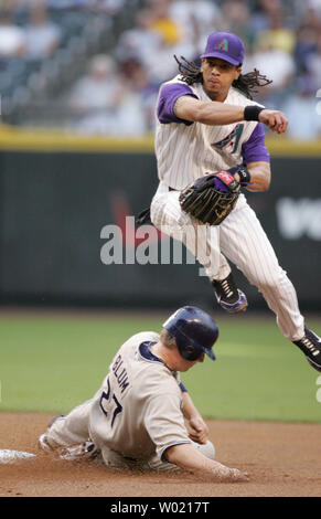 San Diego Padres' Geoff Blum is greeted at home plate by Mike Cameron ...