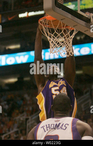 Los Angeles Lakers Kwame Brown dunks over the Phoenix Suns Kurt Thomas in the first quarter of the second game of the NBA play offs in Phoenix, AZ April 26, 2006.       (UPI Photo/Will Powers) Stock Photo