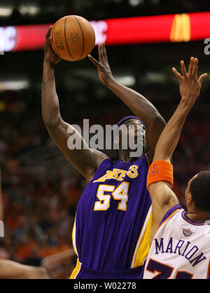 Los Angeles Lakers Kwame Brown shoots over the Phoenix Suns Shawn Marion during the second quarter of the seventh game of the NBA western division quarter finals in Phoenix, AZ May 6, 2006.      (UPI Photo/Rick Scuteri) Stock Photo