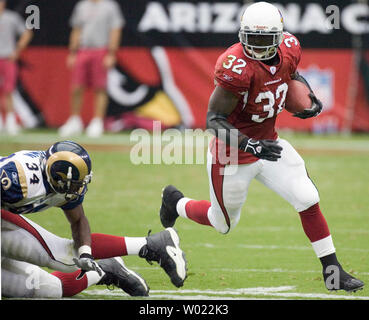 Arizona Cardinals Edgerrin James runs around the defensive line of