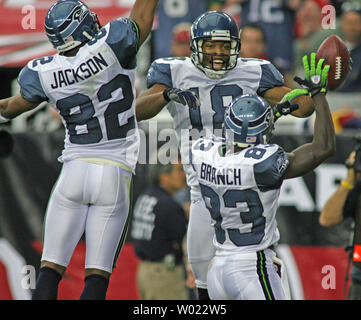 Photo: eattle Seahawks wide receivers Deion Branch (L) and T.J.  Houshmandzadeh walk off the field following their 13-17 loss to the  Tennessee Titans. - SEA201010321 