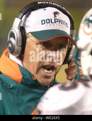 Miami Dolphins head coach Cam Cameron talks to Jason Taylor at Dolphin  Stadium in Miami on