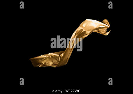 golden soft satin flying in wind on background Stock Photo