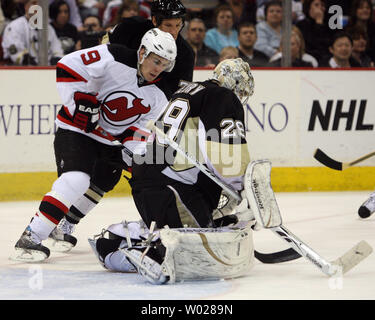 New Jersey Devils' Zach Parise celebrates after scoring an empty-net goal  during the third period of an NHL hockey game against the New York Rangers  on Monday, Feb. 9, 2009 in Newark