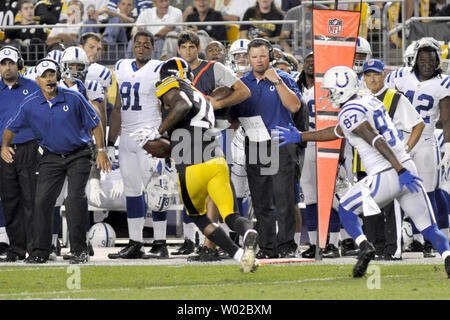 Indianapolis Colts head coach Chuck Pagano watches as Pittsburgh Steelers Ike Taylor intercepts a pass intended for Colts Reggie Wayne and returns it 49 yards for a touchdown in the first quarter at the Heinz Field in Pittsburgh on August 19, 2012.  UPI/Archie Carpenter Stock Photo