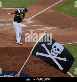 A Pittsburgh Pirates fan waves a Jolly Roger during the opening day baseball  game between the Pittsburgh Pirates and the St. Louis Cardinals at PNC Park  in Pittsburgh, Sunday, April 3, 2016.