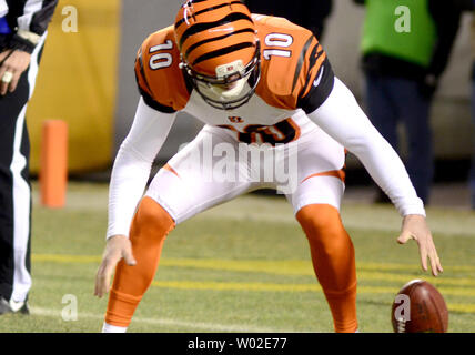 Cincinnati Bengals punter Kevin Huber (10) and kicker Clint Stitser (3)  react in the first half