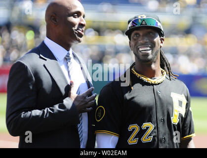 Formr Pirtae player Andy Van Slyke congratulates Pittsburgh Pirates center  fielder Starling Marte (6) on his Golden Glove Award before the start of  the Pittsburgh Pirates Home Opener at PNC Park on April 7, 2017 in  Pittsburgh. Photo by Archie Carpenter