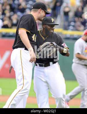 Pittsburgh Pirates' Josh Harrison celebrates as he returns to the ...