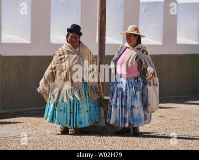 Cholitas at the Basílica de Nuestra Señora church in Copacabana, Bolivia Stock Photo