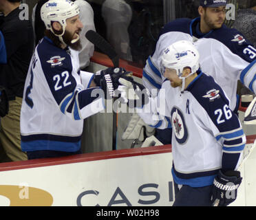 Winnipeg Jets right wing Blake Wheeler (26) celebrates  his goal with Winnipeg Jets right wing Chris Thorburn (22) during the second period of the Penguins 4-1 win over the Winnipeg Jets  at the Consol Energy Center in Pittsburgh on February 27, 2016.   Photo by Archie Carpenter/UPI Stock Photo
