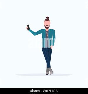 man taking selfie photo on smartphone camera casual male cartoon character posing white background flat full length Stock Vector