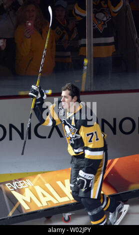 Pittsburgh Penguins goalie Marc-Andre Fleury wave a terrible towel wearing  a Pittsburgh Steelers helmet following the 3-0 shut out win against the New  York Rangers at Mellon Arena in Pittsburgh on January