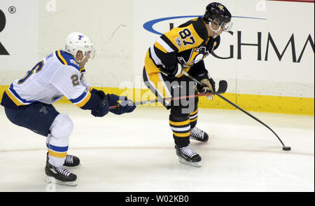 St. Louis Blues center Paul Stastny (26) reaches in with his stick to break up the pass of Pittsburgh Penguins center Sidney Crosby (87) in the second period at the PPG Paints Arena in Pittsburgh on January 24, 2017.   Photo by Archie Carpenter/UPI Stock Photo
