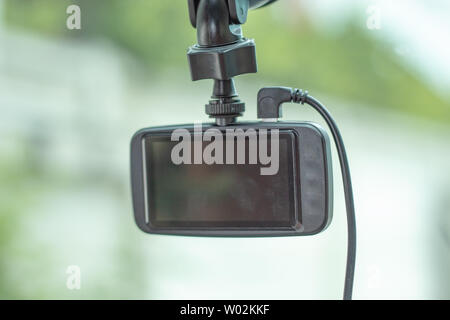 camera in car on green background. Stock Photo