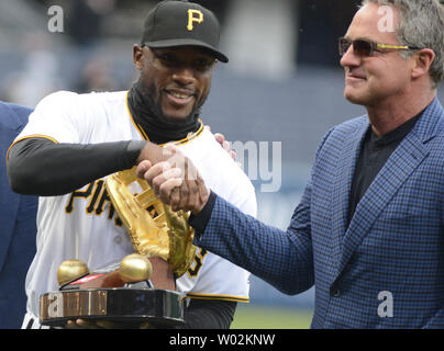 Formr Pirtae player Andy Van Slyke congratulates Pittsburgh Pirates center  fielder Starling Marte (6) on his Golden Glove Award before the start of  the Pittsburgh Pirates Home Opener at PNC Park on April 7, 2017 in  Pittsburgh. Photo by Archie Carpenter