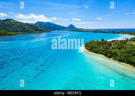 Aerial drone view of French Polynesia Tahiti island Huahine and Motu coral reef lagoon and Pacific Ocean. Tropical paradise. Stock Photo