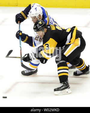 Pittsburgh Penguins defenseman Olli Maatta (3) and St. Louis Blues center Paul Stastny (26) race to the puck during the third period of the St. Louis Blues 5-4 overtime win at PPG Paints Arena  in Pittsburgh on October 4, 2017.   Photo by Archie Carpenter/UPI Stock Photo