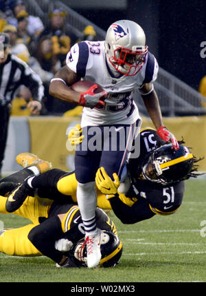 Baltimore Ravens fullback Patrick Ricard (42) runs to the right past  Pittsburgh Steelers linebacker Sean Spence (51) to score in the fourth  quarter at Heinz Field in Pittsburgh on December 10, 2017.