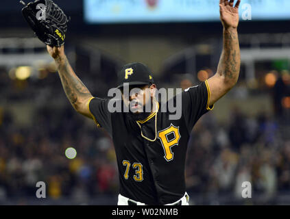 Pittsburgh Pirates relief pitcher Felipe Vazquez, left, celebrates with  catcher Elias Diaz after getting the final out of the team's 8-7 wi over  the Detroit Tigers in a baseball game in Pittsburgh