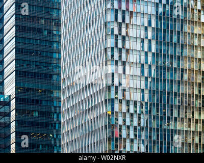 Glass curtain wall in the city of high-rise building Stock Photo