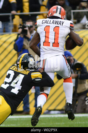 Cleveland Browns wide receiver Antonio Callaway (11) makes a one yard for a touchdown with Pittsburgh Steelers cornerback Coty Sensabaugh (24) in coverage in the fourth quarter of the Steelers 33-18 win at Heinz Field on October 28, 2018 .  Photo by Archie Carpenter/UPI Stock Photo