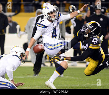 Pittsburgh Steelers cornerback Artie Burns (25) blocks the second field goal attempt of Los Angeles Chargers kicker Mike Badgley (4) but a Pittsburgh Steelers penalty allows for a third try and the Chargers win 33-30 at Heinz Field in Pittsburgh on December 2, 2018.  Photo by Archie Carpenter/UPI Stock Photo