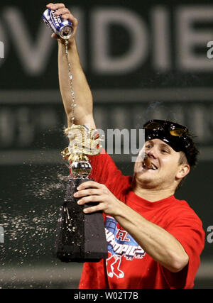 Boston Red Sox pitcher Jonathan Papelbon pours beer over the American League Championship trophy while celebrating his teams seventh game 11-2 win over the Cleveland Indians in the American League Championship Series at Fenway Park in Boston on October 20, 2007. (UPI Photo/Matthew Healey) Stock Photo