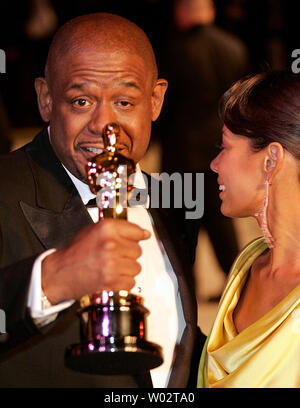 Best Actor Oscar winner Forest Whitaker (L) and his wife Keisha (R) arrive at the Vanity Fair post-79th Academy Awards party at Morton's in West Hollywood on February 25, 2007.   (UPI Photo/Gary C. Caskey) Stock Photo