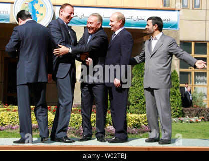 (L-R) Turkmenistan's President Gurbanguli Berdymukhamedov, Azerbaijan's President Ilham Aliyev, Kazakhstan's President Nursultan Nazarbayev, Russian President Vladimir Putin and Iranian President Mahmoud Ahmadinejad arrive for a group photo during the Caspian Sea Littoral States summit in Tehran on October 16, 2007. Caspian Sea states declared on Tuesday they would not let their soil be used for an attack on any of them, an apparent response to speculation the United States could resort to force in its nuclear row with Iran. (UPI Photo/Anatoli Zhdanov) Stock Photo