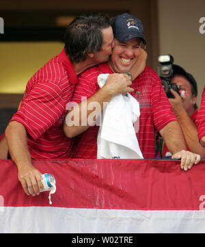 Team USA captain Paul Azinger (L) kisses player Boo Weekley after the USA defeated team Europe 16 1/2 to 11 1/2 to win the Ryder Cup at the Valhalla Golf Club in Louisville, Kentucky on September 21, 2008. Team USA defeated team Europe for the first time since 1999. (UPI Photo/Mark Cowan) Stock Photo