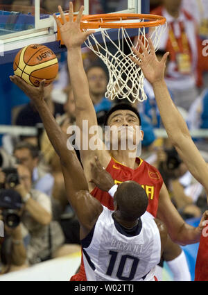 USA's Kobe Bryant's shot is blocked by China's Yao Ming  during their game in the preliminary round of the men's Olympic basketball competition in Beijing on August 10, 2008.  USA won 101-70.  (UPI Photo/Stephen Shaver) Stock Photo