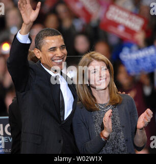 Democratic presidential hopeful Sen. Barack Obama (D-IL) (L) waves with Caroline Kennedy, daughter of the late President John Kennedy, as he receives presidential endorsements from Sen. Edward Kennedy (D-MA), Rep. Patrick Kennedy (D-MA) and Caroline at a rally at American University in Washington on January 28, 2008.  Ted Kennedy's endorsement was sought by all three of the Democratic presidential contenders.  (UPI Photo/Pat Benic) Stock Photo