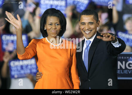 Democratic presidential candidate Sen. Barack Obama (D-IL) and his wife Michelle wave to the crowd after Obama delivered election night remarks after winning the North Carolina Primary at a rally at the North Carolina State University in Raleigh on May 6, 2008. Both North Carolina and Indiana held primaries today. (UPI Photo/Kevin Dietsch) Stock Photo