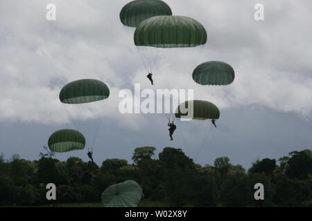 French, British, German and U.S. paratroopers parachute over Ste.-Mere-Eglise, France on June 6, 2009. The paratroopers are jumping in honor of the 65th anniversary of the D-Day invasion of Normandy. Ste.-Mere-Eglise is the area most known as the first French town liberated by Allied forces during World War II. UPI/Alfredo Barraza Jr./U.S. Army Stock Photo