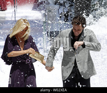 Actress Jenny McCarthy and actor Jim Carrey arrive at a photocall for the film 'A Christmas Carol' at the 62nd annual Cannes Film Festival in Cannes, France on May 18, 2009.   UPI/David Silpa Stock Photo