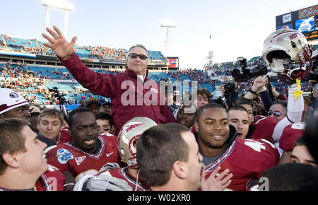 Retiring Florida State head coach Bobby Bowden takes a ride off the field after coming from behind to defeat West Virginia 33-21 in Jacksonville, Florida January 1, 2010.  It was coach Bowden's final game.  UPI/ Mark Wallheiser Stock Photo