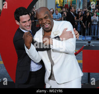 Justin Bartha (L) and Mike Tyson, cast members in the motion picture comedy 'The Hangover Part II', ham it up during the premiere of the film at Grauman's Chinese Theatre in the Hollywood section of Los Angeles on May 19, 2011.  UPI/Jim Ruymen Stock Photo