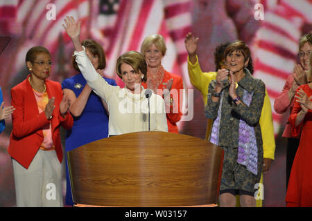 Rep. Nancy Pelosi (CA), House Minority Leader, and the House of Representatives congresswomen appear at the Democratic National Convention at the Time Warner Cable Arena in Charlotte, North Carolina on September 4, 2012.   UPI/Kevin Dietsch Stock Photo