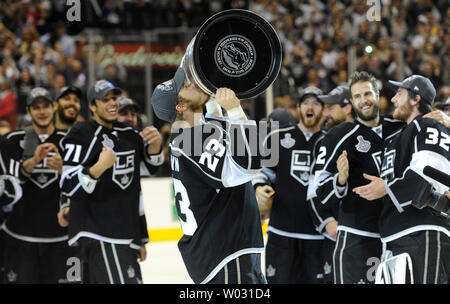 Los Angeles Kings right wing Dustin Brown (23) celebrates with the Cup at the end of game 6 of the NHL Stanley Cup Finals against the New Jersey Devils at the Staples Center in Los Angeles, California on June 11, 2012. The Kings won 6-1. UPI/Lori Shepler. Stock Photo