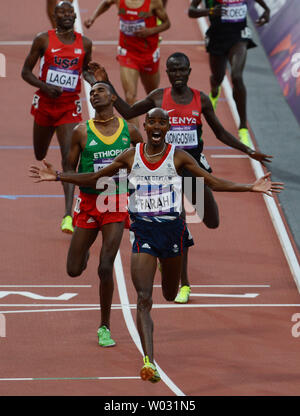 Great Britain's Mo Farah raises his arms as he wins the Men's 5000 metres final on the ninth day of the Athletics in the Olympics stadium at the London 2012 Summer Olympics on August 11, 2012 in  London.     UPI/Hugo Philpott Stock Photo