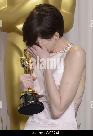Anne Hathaway becomes emotional as she poses with her Oscar for Best Performance by an Actress in a Supporting Role for 'Les Miserables' backstage at the 85th Academy Awards at the Hollywood and Highlands Center in the Hollywood section of Los Angeles on February 24, 2013.. UPI/Phil McCarten