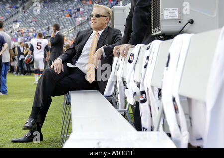 Denver Broncos Executive Vice President of Football Operations John Elway sits on the Broncos bench while the Denver Broncos and New York Giants warm up before the game in week 2 of the NFL season at MetLife Stadium in East Rutherford, New Jersey on September 15, 2013.     UPI /John Angelillo Stock Photo