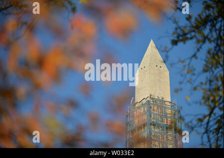 The Washington Monument is seen as workers remove trees at East Potomac ...
