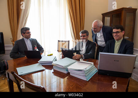 Iranian Foreign Minister Mohammad Javad Zarif (C) reviews the nuclear negotiation documents at the the Coburg Palace Hotel in Vienna, Austria on Saturday, July 11, 2015.  Zarif and U.S. Secretary of State John Kerry have met nearly every day for the past several weeks to iron out the final details of a possible nuclear agreement. Photo by Ali Mohammadi/UPI Stock Photo
