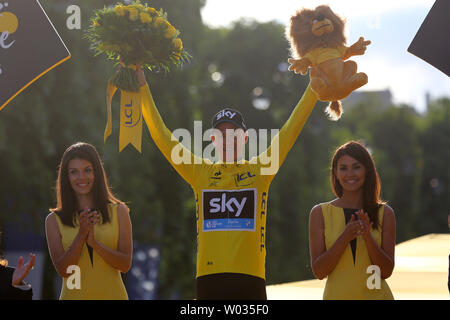 Chris Froome of Great Britain celebrates on the presentation podium after winning the Tour de France in Paris on July 26, 2015.  Froome claimed his second Tour de France victory, becoming the first Briton to do so.   Photo by David Silpa/UPI Stock Photo