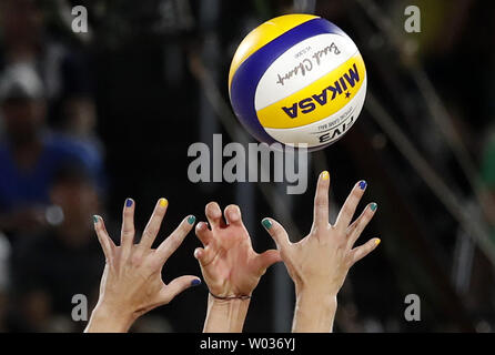 Silver medalists Agatha Bednarczuk Rippel of Brazil and Gold Medalist Laura Ludwig of Germany leap at net for a ball in the Women's Beach Volleybal at the Beach Volleyball Arena at the 2016 Rio Summer Olympics in Rio de Janeiro, Brazil, on August 17, 2016.      Photo by Matthew Healey/UPI Stock Photo