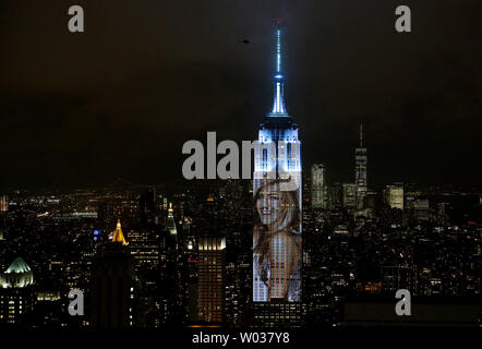An artist rendering image of Jennifer Aniston is projected onto the Empire State Building in the Manhattan skyline to celebrate Harper Bazaar's 150th anniversary on April 19, 2017, in New York City. Spanning 42 floors of the building and rising 500 feet high, the show featured iconic fashion images of everyone from Audrey Hepburn to Kate Moss, including iconic works by the likes of Andy Warhol. Photo by John Angelillo/UPI Stock Photo