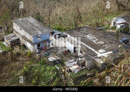 While conducting search and rescue in the mountains of Puerto Rico a CBP Air and Marine Operations Black Hawk located this home a half mile from its peek with HELP painted it is roof. Photo by Kris Grogan/U.S. Customs and Border Protection/UPI Stock Photo